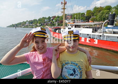 children on a ferry on River Elbe passing Museum Harbour Oevelgoenne, Harbour, Hamburg, Germany Stock Photo