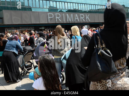 Berlin, Germany. 03rd July, 2014. A crowd of people stand outside during the opening of a Primark store at Alexanderplatz in Berlin, Germany, 03 July 2014. Photo: BRITTA PEDERSEN/dpa/Alamy Live News Stock Photo