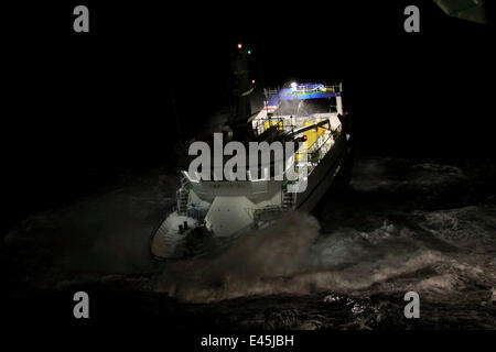Fishing vessel 'Harvester' on a stormy night, North Sea, October 2009. Property Released. Stock Photo