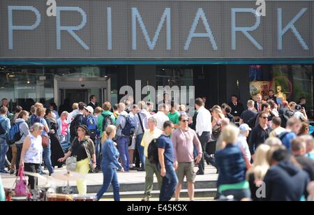 Berlin, Germany. 03rd July, 2014. A crowd of people stand outside during the opening of a Primark store at Alexanderplatz in Berlin, Germany, 03 July 2014. Photo: BRITTA PEDERSEN/dpa/Alamy Live News Stock Photo