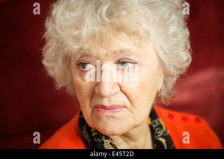 A close up head shot of a senior woman. Stock Photo