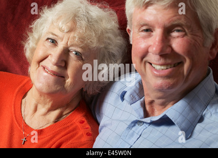 A senior couple relaxing indoors. Stock Photo