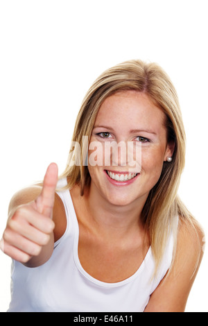 A young, successful woman holds her thumb up. Symbol for success, released, white background Stock Photo