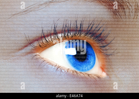 Woman blue eye looking on a digital virtual screen close-up Stock Photo