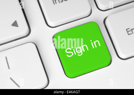 Green sign in button on keyboard close-up Stock Photo