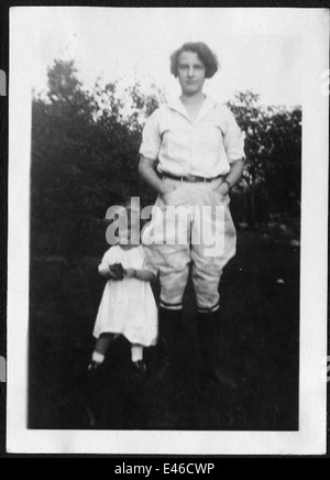 Helen Richey, a pioneering aviator, is seen outdoors in boots, jodhpurs ...