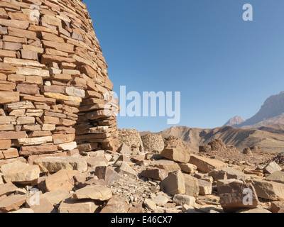 UNESCO World Heritage site in Oman Middle East. Ancient Beehive tombs on a ridge top in the Hajjar mountains near Al-Ayn. Stock Photo