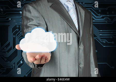 Businessman with cloud on dark circuit board background, cloud computing concept Stock Photo