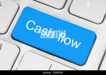 Blue cash flow button on white keyboard Stock Photo