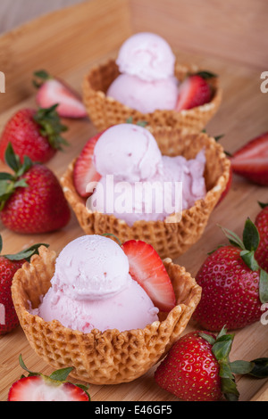 Strawberry ice cream in waffle bowls Stock Photo