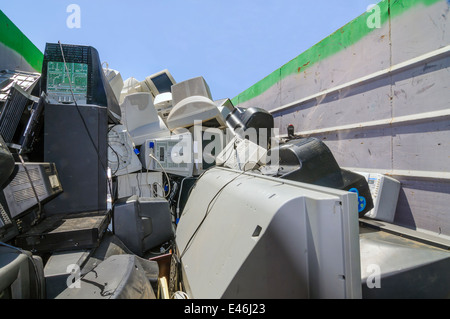 Used computers and other electronics in dumpster at electronic waste collection for community ewaste recycling fundraiser Stock Photo
