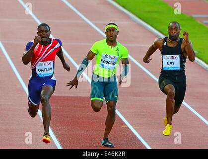 Lausanne, Switzerland. 3rd July, 2014. (From L to R) Justin Gatlin, Michael Rodgers and Tyson Gay of the United States compete during the men's 100m race during the IAAF Diamond League Meetings in Lausanne, Switzerland, July 3, 2014. Justin Gatlin claimed the title of the event in 9.80 seconds. Credit:  Gong Bing/Xinhua/Alamy Live News Stock Photo