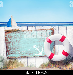 Empty Sign Board and Wooden Fence on Beach Stock Photo