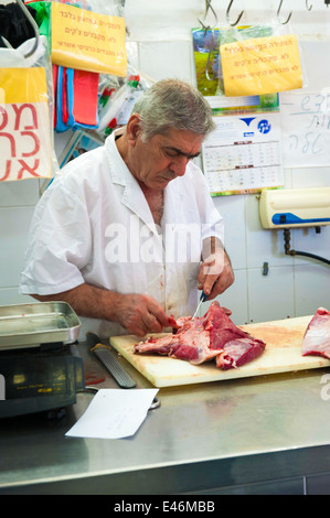 Amos the butcher, at work in the butcher shop, Jaffa, Israel Stock Photo