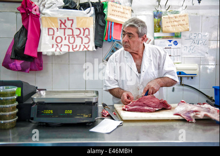 Amos the butcher, at work in the butcher shop, Jaffa, Israel Stock Photo