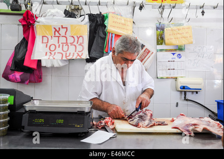 Amos the butcher, at work in the butcher shop, Jaffa, Israel Stock Photo