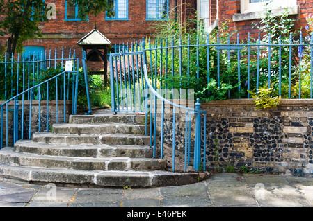 Gated natural stone stairs in home garden Stock Photo