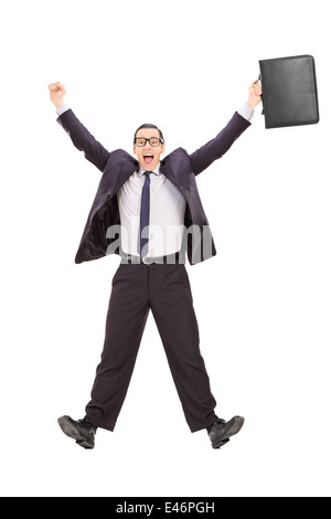 Full length portrait of an overjoyed businessman shot in mid-air Stock Photo