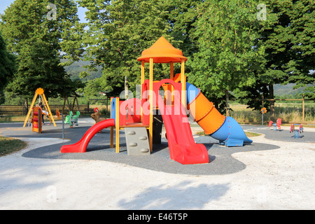 Children's school playground with slides and swings Stock Photo