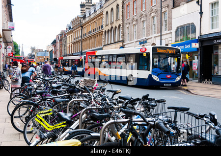 Busy St Andrews street, bicycles and buses in Cambridge UK Stock Photo