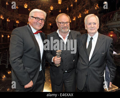 Austrian filmmaker and actor Klaus Maria Brandauer (C) celebrates his award with his laudators, Hungarian filmmaker Istvan Szabo (R) and Foreign Minister Frank-Walter Steinmeier, during the awarding ceremony of the 'The Bridge - German Cinema Award for Peace 2014' in Munich, Germany, 03 July 2014. The prize is awarded on occasion of the 32nd annual Munich Film Festival that runs from 27 June to 05 July. Photo: URSULA DUEREN/dpa Stock Photo