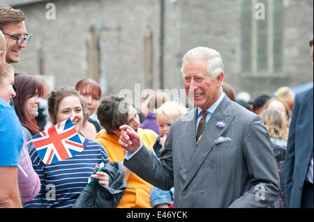 Brecon, Powys, Wales, UK. 4th July 2014. HRH meets children from Brecon Primary school. Prince Charles visits the Welsh market town of Brecon on the last day of the royal ‘Summer visit to Wales: Celebrating Wales, Past, Present and Future.’ After a walk through the town centre, HRH viewed the magnificent decorative and ornate Victorian interior of the recently restored Grade II listed Plough Chapel. Credit:  Graham M. Lawrence/Alamy Live News. Stock Photo