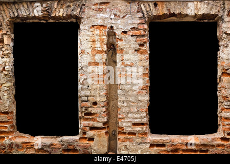 Empty black windows zones for advertizing in the old brick destroyed wall. Zones isolated with patch Stock Photo