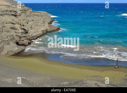 Visitors swim at the Mahana Beach near Naalehu (Hawaii). Stock Photo