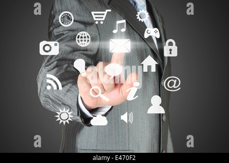 Man pushes icon on dark background Stock Photo