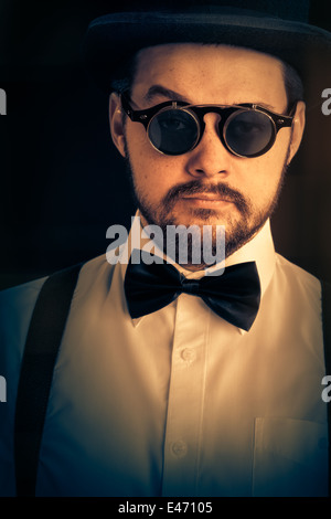 Man with Top Hat and Steampunk Glasses Retro Portrait Stock Photo