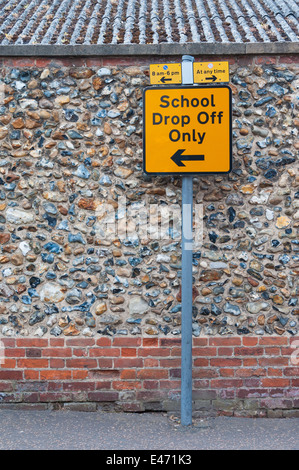 Sign post for school drop off only on UK road Stock Photo