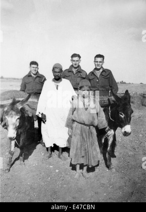 British REME soldiers with locals father and son with donkeys at Tel-el-Kebir Egypt 1943 World War Two 2 Stock Photo