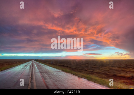 Wet road after a rain at sunset, Bernalillio co., New Mexico, USA. Stock Photo