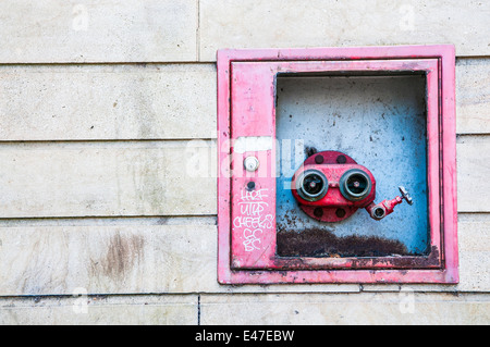 Red fire hydrant with hose connected for use in construction zone in Eagle  Mountain, Utah Stock Photo - Alamy