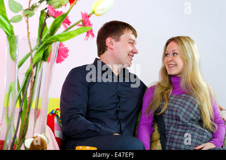 Portrait of happy young  pregnant woman and her husband indoor Stock Photo