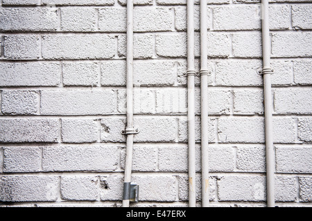 Brick Wall Electrical Conduit Stock Photo 1256096542