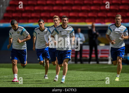 Brasilia. 4th July, 2014. Argentina's Lionel Messi (4th L) warms up with his teammates during a training session in Brasilia, Brazil, on July 4, 2014, one day ahead of a quarter-finals match between Argentina and Belgium of 2014 FIFA World Cup. Credit:  Liu Dawei/Xinhua/Alamy Live News Stock Photo