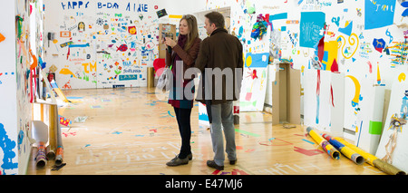 Tourists at Atelier Public 2, exhibition of artwork by members of the public in Gallery of Modern Art, GoMA, Glasgow,SCOTLAND UK Stock Photo