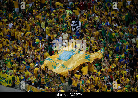 Fortaleza, Brazil. 4th July, 2014. Brazil's fans celebrate their team's victory after a quarter-finals match between Brazil and Colombia of 2014 FIFA World Cup at the Estadio Castelao Stadium in Fortaleza, Brazil, on July 4, 2014. Brazil won 2-1 over Colombia and qualified for semi-finals on Friday. Credit:  Liao Yujie/Xinhua/Alamy Live News Stock Photo