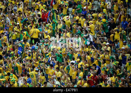 Fortaleza, Brazil. 4th July, 2014. Brazil's fans celebrate their team's victory after a quarter-finals match between Brazil and Colombia of 2014 FIFA World Cup at the Estadio Castelao Stadium in Fortaleza, Brazil, on July 4, 2014. Brazil won 2-1 over Colombia and qualified for semi-finals on Friday. Credit:  Liao Yujie/Xinhua/Alamy Live News Stock Photo