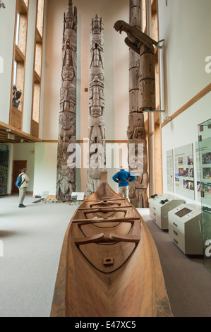 Carved first nation canoe totems Haida Heritage Centre Kaay Llnagaay, Haida Gwaii Queen Charlotte City Islands British Columbia. Stock Photo