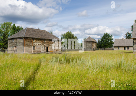 Old log cabins house buildings at Fort Saint St James National Historic Site trading post, British Columbia, Canada. Stock Photo