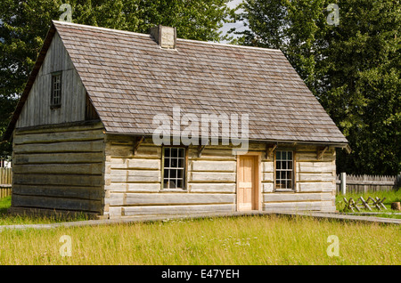 Old log cabin house building at Fort Saint St James National Historic Site trading post, British Columbia, Canada. Stock Photo