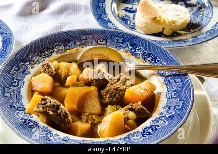 Bowl of beef stew biscuit dinner at Fort Saint James National Historic Site trading post, British Columbia, Canada. Stock Photo