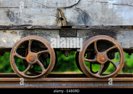 Two rusting wheels on an old and disused mining carriage, Auchinleck, Ayrshire,Scotland, UK Stock Photo