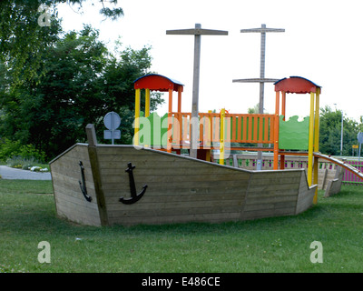 cheerful children's playground is located in a wooden board Stock Photo