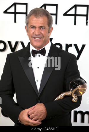 Actor Mel Gibson accepts the Crystal Globe for Outstanding Artistic Contribution to World Cinema during the opening of the 49th Karlovy Vary International Film Festival at Hotel Thermal in Karlovy Vary, Czech Republic, on 04 July 2014. Photo: Hubert Boesl - NO WIRE SERVICE Stock Photo