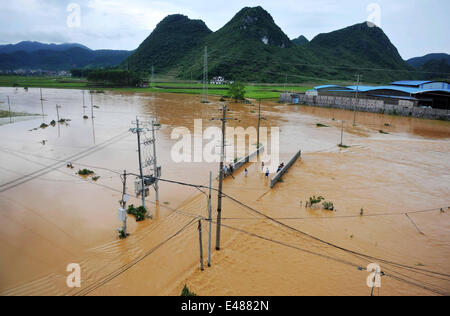 (140705) -- MASHAN, July 5, 2014 (Xinhua) -- This bird eye view shows a flooded area in Mashan County, south China's Guangxi Zhuang Autonomous Region, July 5, 2014. Torrential rain hit Guangxi since July 4, where the precipitation exceeded 100 mm in 21 counties. (Xinhua/Zhang Ailin) (hdt) Stock Photo