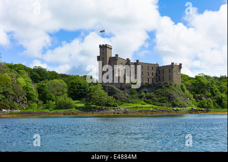 Highland fortress Dunvegan Castle, Highlands ancestral home of MacLeod clan, Dunvegan Loch sea loch on the Isle of Skye SCOTLAND Stock Photo