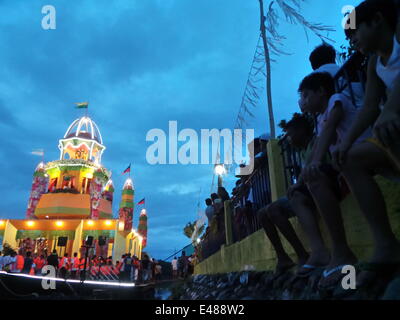 The fluvial parade is held during the eve of Pagoda Festival which is ...